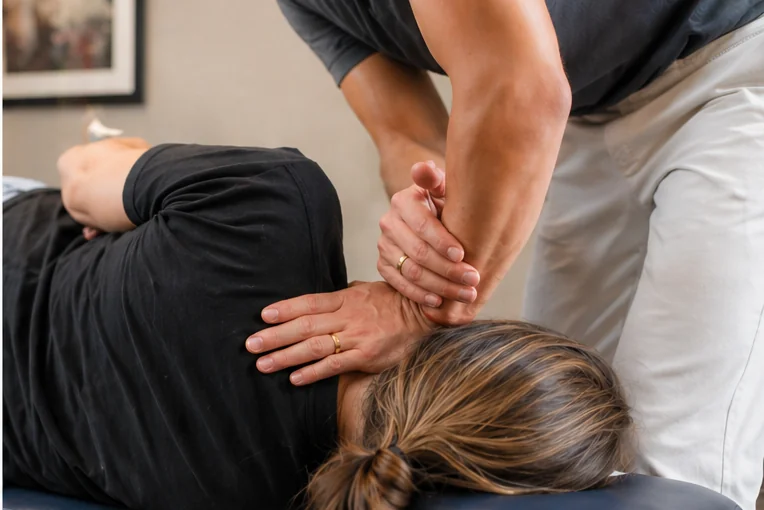 Dr. Palmer Piana performing a side-posture Blair upper cervical adjustment on a patient
