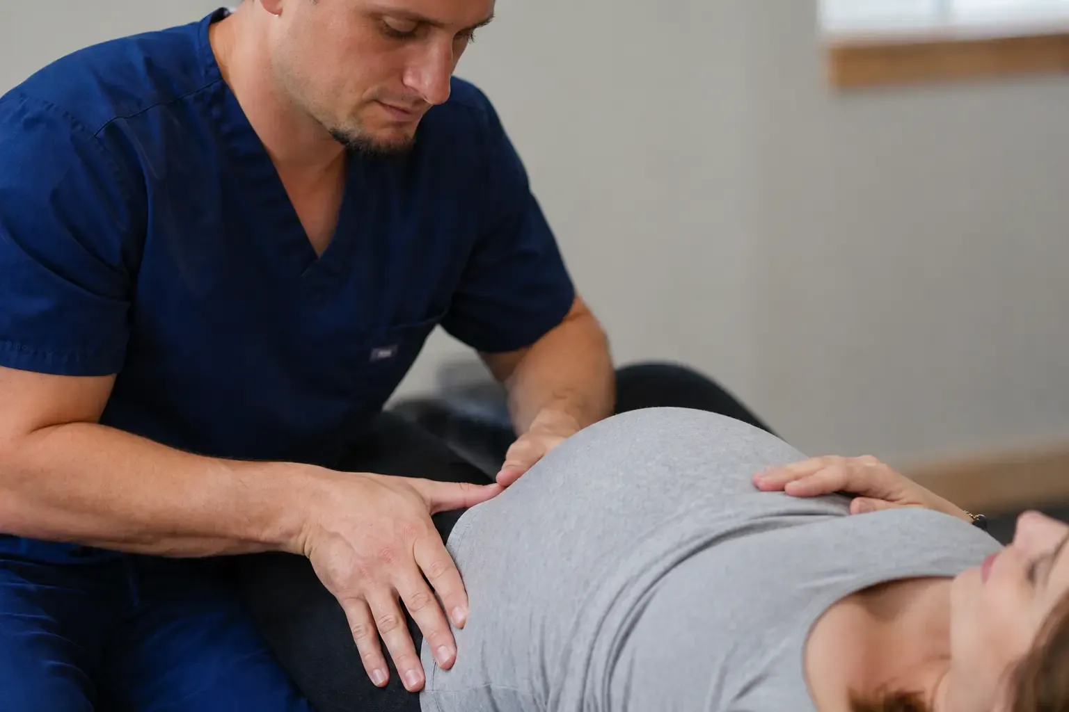 Dr. Palmer performing Webster technique prenatal chiropractic adjustment at Life Charge Chiropractic Gallatin TN