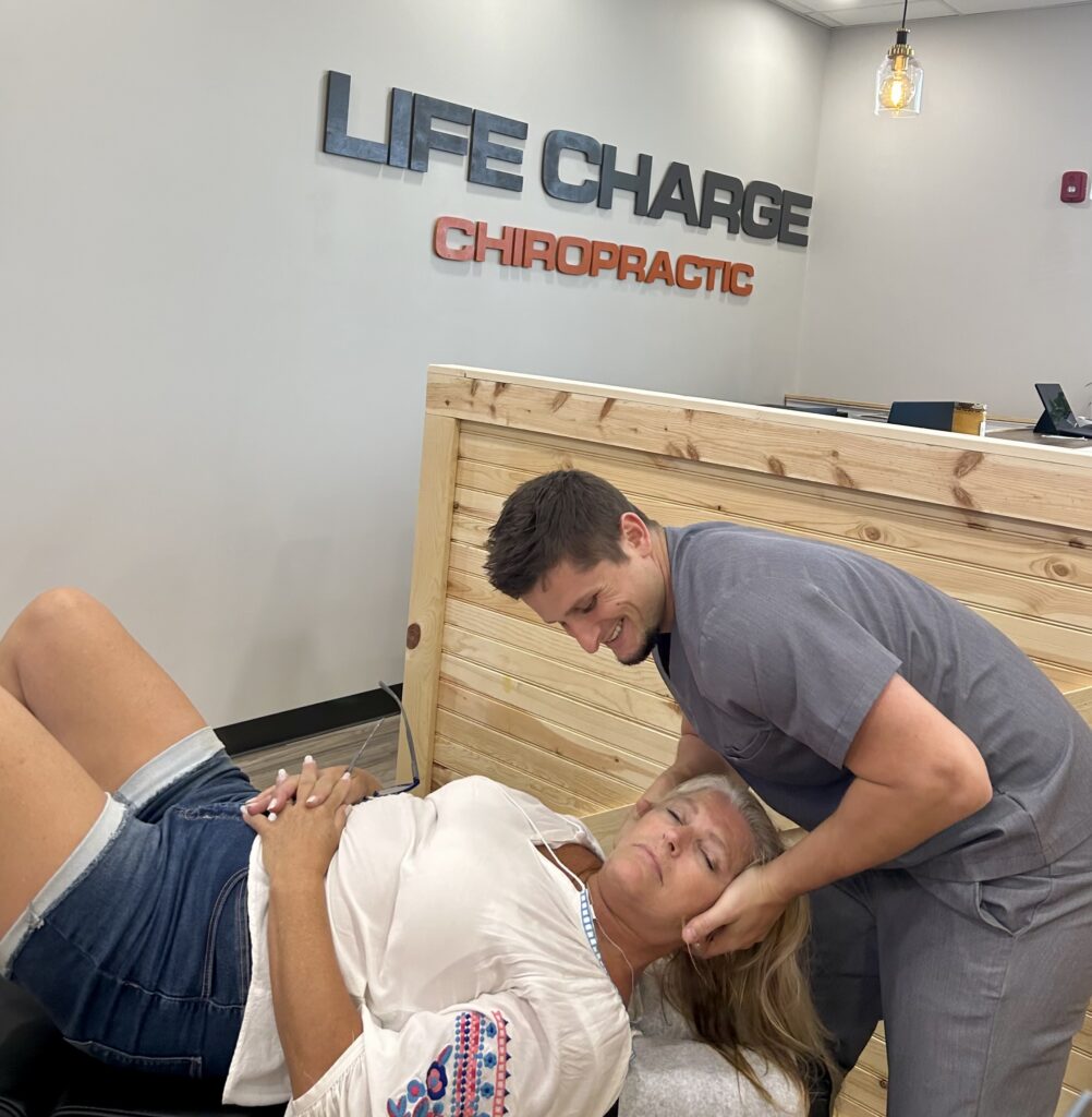 Dr. Palmer performing Chiropractic Adjustment