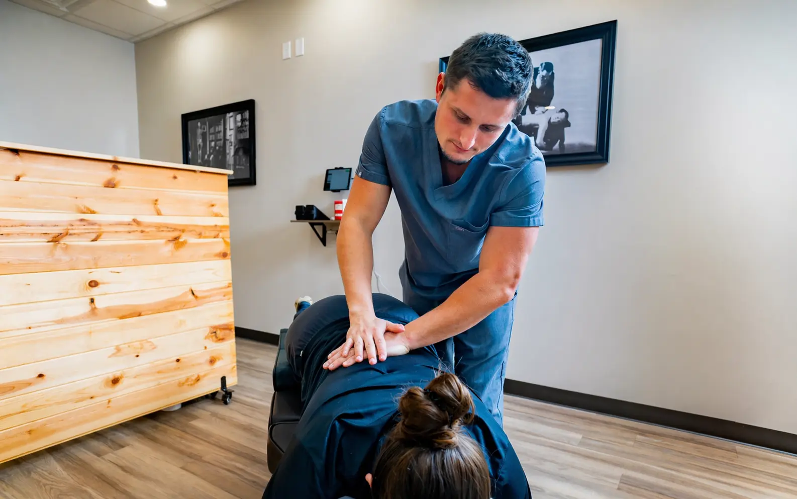 Dr. Palmer manually Adjusting patient - Palmer College of Chiropractic